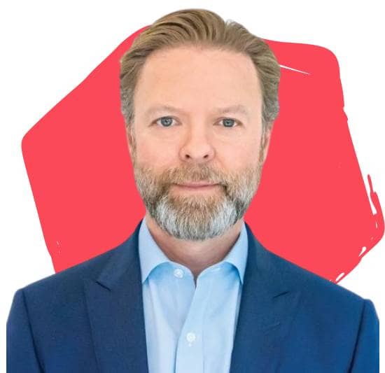 Jason Fox, Board Director, in front of a red hexagon